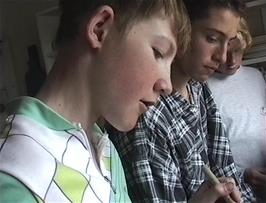 Craig, Luke and Llewellyn prepare their evening meals in the kitchen at Tyncornel youth hostel